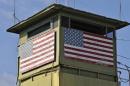 A U.S. Marine guard tower overlooks the Northeast gate leading into Cuba territory at Guantanamo Bay U.S. Naval Base