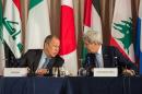 Russian Foreign Minister Sergei Lavrov and United States Secretary of State John Kerry speak during the International Syria Support Group meeting, September 22, 2016 in New York