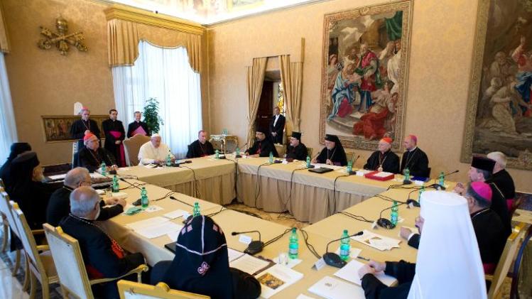 This handout picture released on November 21, 2013 by the Vatican press office shows Pope Francis during a meeting with Patriarchs and Major Archbishops of the Eastern Churches for Syria, Iraq and the Middle East at the Vatican