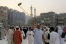 A Muslim pilgrim takes selfie at the Grand mosque in Mecca