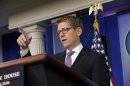 White House press secretary Jay Carney gestures as he speaks during the daily briefing at the White House in Washington, Tuesday, July 23, 2013. Carney was asked about Syria, immigration, the death of veteran White House journalist Helen Thomas and the birth of the new prince. (AP Photo/Susan Walsh)