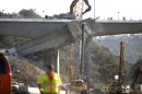 Workers continue the demolition of the center span of the Mulholland Drive bridge along Interstate 405 in Los Angeles on Saturday Sept. 29,2012. Construction crews are on schedule and traffic tie-ups are minimal in Los Angeles, making for a smooth start to Carmageddon II, the sequel to last year's shutdown of one of the nation's busiest freeways. (AP Photo/Richard Vogel)