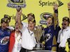 Team owner Roger Penske, third from left, and Brad Keselowski, second from right, celebrate after Keselowski won the NASCAR Sprint Cup Series championship following an auto race at Homestead-Miami Speedway in Homestead, Fla., Sunday, Nov. 18, 2012. (AP Photo/Alan Diaz)