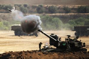 An Israeli artillery gun fires a shell towards targets &hellip;