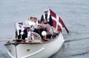 Denmark's Crown Prince Frederik and Crown Princess Mary arrive with their children on a boat in Nuuk