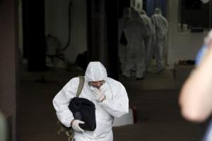 A forensic police official is seen at the Radisson&nbsp;&hellip;