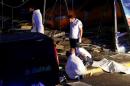 Forensic experts work outside Turkey's largest airport following a blast