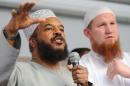 In this file photo, Islamist preacher Abu Ameenah Bilal Philips (L) is seen next to a fellow preacher, Pierre Vogel, during a gathering in Frankfurt, Germany, on April 20, 2011