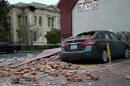 Bricks from a damaged building sit on a car following a reported 6.0 earthquake on August 24, 2014 in Napa, California