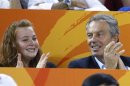 Former British Prime Minister Tony Blair and his daughter Kathryn cheer British track cyclists at the Beijing 2008 Olympic Games