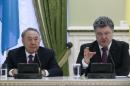 Ukrainian President Petro Poroshenko and his Kazakh counterpart Nursultan Nazarbayev attend a news conference in Kiev