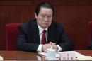 China's former Politburo Standing Committee Member Zhou Yongkang attends the closing ceremony of the NPC in Beijing