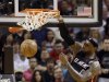Miami Heat's LeBron James (6) dunks against the Indiana Pacers during the first half of an NBA basketball game in Miami, Sunday, March 10, 2013. (AP Photo/Alan Diaz)