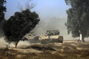 Israeli Merkava tanks drive through trees in southern &hellip;