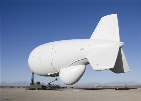 A Raytheon Joint Land Attack Cruise Missile Defense Elevated Netted Sensor System (JLENS) aerostat is pictured at the White Sands Missile Range, New Mexico, in this February 24, 2012 photo obtained on February 1, 2013. A pair of the bulbous, helium-filled "aerostats" - each more than three quarters the length of a football field at 243 feet (74 meters) are to be added to a high-tech shield designed to protect the Washington DC area from air attack. Picture taken February 24, 2012. REUTERS/John Hamilton/DVIDS/Handout