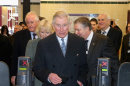 Britain's Prince Charles, and Camilla, Duchess of Cornwall, walk through a ticket barrier as they prepare to travel on a London underground train as they mark 150 years of London Underground, Wednesday Jan. 30, 2013. (AP Photo/Chris Jackson, Pool)