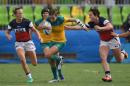 Australia's Chloe Dalton runs with the ball in a women's rugby sevens match against USA on August 7, 2016