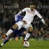 Fulham's Dempsey challenges Chelsea's Mikel during their English Premier League soccer match at Craven Cottage in London
