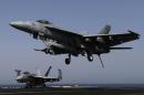 A F/A-18E comes in to land onboard USS George H.W. Bush in the Gulf