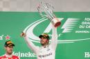 British racing driver Lewis Hamilton of team Mercedes celebrates his victory in the 2016 Canadian Formula 1 Grand Prix at the Circuit Gilles Villeneuve in Montreal on June 12, 2016