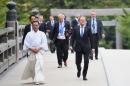 European Council President Donald Tusk (R) arrives at Ise-Jingu Shrine in the city of Ise on the first day of the G7 leaders summit