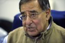 Defense Secretary Leon Panetta talks to reporters while on board his plane headed to Kuwait, Tuesday, Dec. 11, 2012. Panetta will meet with troops as part of a visit to thank the troops for their service. (AP Photo/Susan Walsh, Pool)