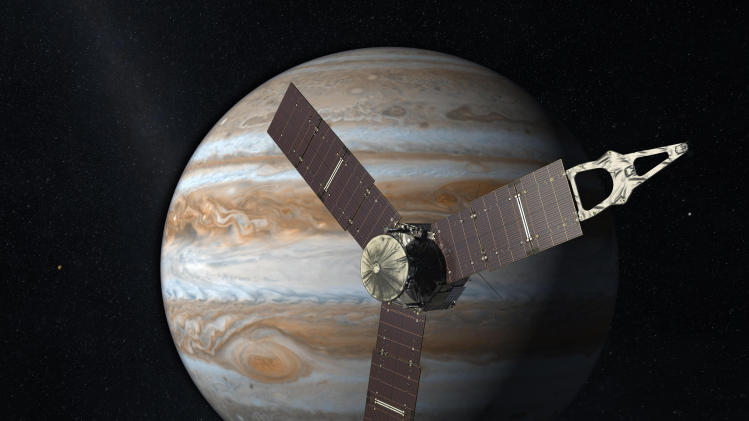 FILE - This 2010 artist's rendering depicts NASA's Juno spacecraft with Jupiter in the background. NASA's Jupiter-bound spacecraft will swing by Earth for one last visit Wednesday Oct. 9, 2013 before speeding to the outer solar system. Wednesday's flyby allows the Juno spacecraft to gather the momentum it needs to arrive at Jupiter in 2016. (AP Photo/NASA/JPL, File)