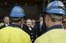 U.S. Secretary of State Hillary Rodham Clinton, center, meets with shipbuilders at the Techport Australia shipbuilding facility near Adelaide, Australia Thursday, Nov. 15, 2012. (AP Photo/Matt Rourke, Pool)