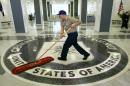 a workman slides a dustmop over the floor at the Central Intelligence Agency headquarters in Langley