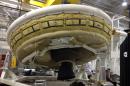 This undated image provided by NASA shows a saucer-shaped test vehicle holding equipment for landing large payloads on Mars in the Missile Assembly Building at the U.S Navy's Pacific Missile Range Facility at Kekaha on the island of Kaua'i in Hawaii. The vehicle, part of the Low Density Supersonic Decelerator project, will test an inflatable decelerator and a parachute at high altitudes and speeds over the Pacific Missile Range scheduled for June 1, 2014. (AP Photo/NASA)