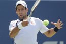 Serbia's Novak Djokovic returns a shot to Brazil's Rogerio Dutra Silva in the third round of play at the 2012 US Open tennis tournament, Friday, Aug. 31, 2012, in New York. (AP Photo/Mike Groll)