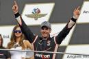Will Power, of Australia, celebrates after winning the Grand Prix of Indianapolis auto race at Indianapolis Motor Speedway in Indianapolis, Saturday, May 9, 2015. (AP Photo/Michael Conroy)