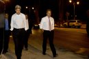Escorted by security, U.S. Secretary of State John Kerry, left, walks with Frank Lowenstein, senior advisor to the secretary on Middle East issues, through the streets of Jerusalem just after 4 a.m. on Sunday, June 30, 2013 after finishing a meeting with Israeli Prime Minister Netanyahu that took over six hours. After the marathon meeting, Kerry decided to get some air by walking to a park near the hotel where he is staying and the meeting was held. Kerry is shuttling between Palestinian and Israeli leaders in hopes of restarting peace talks. (AP Photo/Jacquelyn Martin, Pool)