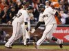 San Francisco Giants' Sandoval celebrates with teammate Scutaro after hitting a two RBI home run against the Detroit Tigers in the third inning during Game 1 of the MLB World Series baseball championship in San Francisco