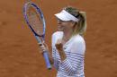 Russia's Maria Sharapova celebrates winning her third round match of the French Open tennis tournament against Australia's Samantha Stosur in two sets 6-3, 6-4, at the Roland Garros stadium, in Paris, France, Friday, May 29, 2015. (AP Photo/Thibault Camus)