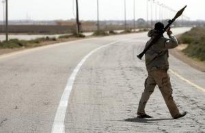 Libya Dawn fighter shoulders a RPG launcher at a checkpoint &hellip;