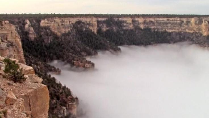 Billowy clouds fill the Grand Canyon
