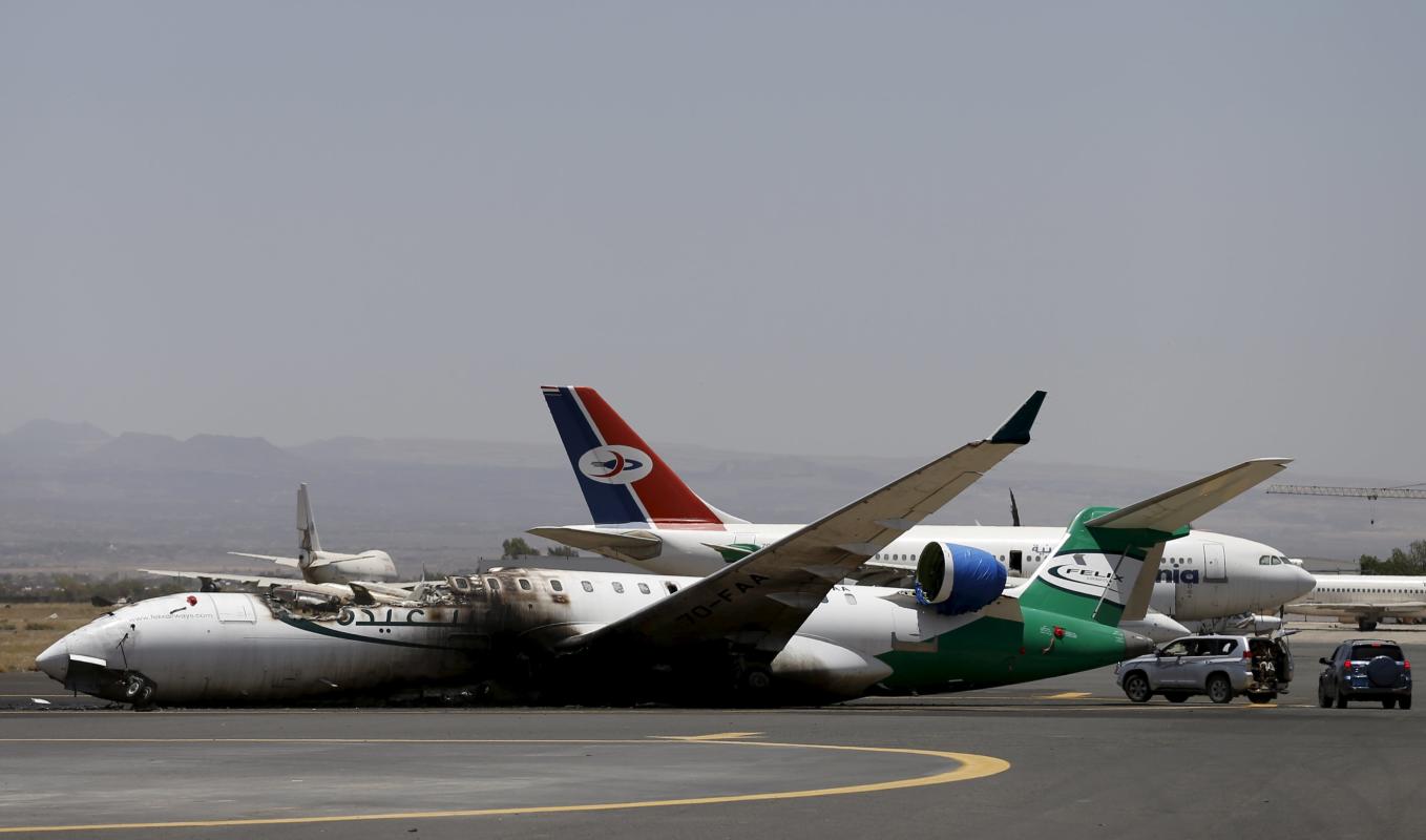 A Felix Airways plane is seen after it was destroyed by an air strike at the international airport of Yemen&#39;s capital Sanaa