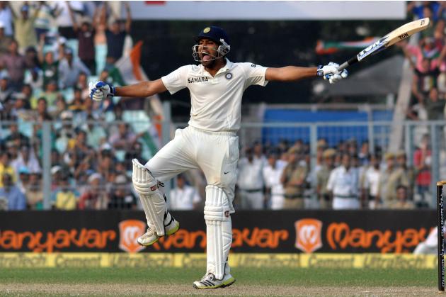 Indian batsman Rohit Sharma celebrates his century during the 2nd day of the 1st test match between India and West Indies at Eden Gardens, Kolkata on Nov. 7, 2013. (Photo: IANS)