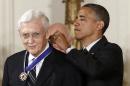 FILE - In this May 29, 2012 file photo, President Barack Obama awards the Medal of Freedom to John Doar, who handled civil rights cases in the 1960's, during a ceremony in the East Room of the White House in Washington. Doar, who as a top Justice Department civil rights lawyer in the 1960s fought to protect the rights of black voters and integrate universities in the South, died Tuesday at age 92. (AP Photo/Charles Dharapak, File)