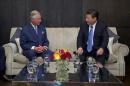 Britain's Prince Charles speaks with China's President Xi Jinping at the Mandarin Oriental hotel in London