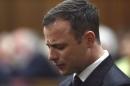 Olympic and Paralympic track star Pistorius reacts during judgement at the North Gauteng High Court in Pretoria