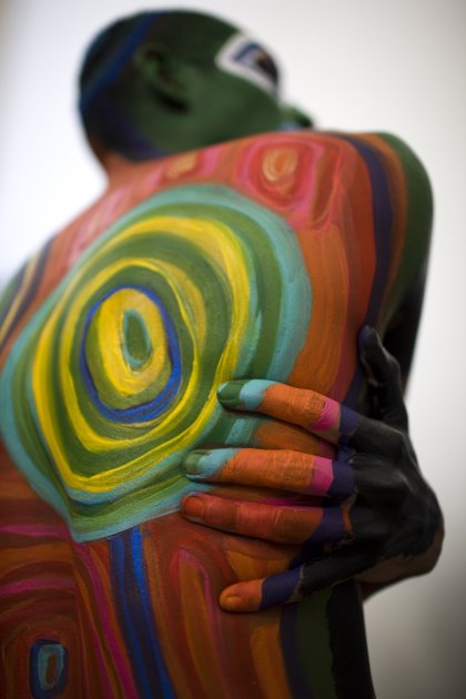 A man covered in body paint …