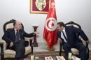 Tunisia's Minister of Interior, Lotfi Ben Jeddou (R) speaks with French counterpart Bernard Cazeneuve (L) in Tunis on November 10, 2014