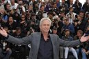 Cast member Michael Douglas poses during a photocall for the film "Behind the Candelabra" at the 66th Cannes Film Festival in Cannes