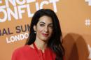 FILE - The June 12, 2014 file photo shows Amal Alamuddin, human rights lawyer and fiancee of US actor George Clooney, as she attends the 'End Sexual Violence in Conflict' summit in London. Alamuddin has been chosen for the U.N.'s three-member commission of inquiry looking into possible violations of the rules of war in Gaza, United Nations Human Rights Council said Monday, Aug. 11, 2014. (AP Photo/Lefteris Pitarakis, file)