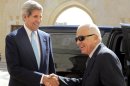 US Secretary of State John Kerry (left) greets Arab League Secretary General Nabil el-Araby on July 17, 2013 in Amman
