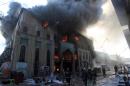 Heavy smoke billows from Baghdad's historic Shorjah market after it was hit by two bomb blasts on February 13, 2014
