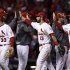 St. Louis Cardinals' Descalso, Carpenter and Freese celebrate after defeating the San Francisco Giants in Game 4 of their MLB NLCS playoff baseball series in St. Louis