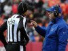 Indianapolis' coach Pagano speaks with line judge Arthur during a NFL football game in Kansas City, Missouri
